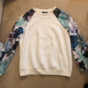 White pullover with multicolored floral sleeves